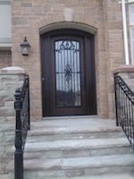 Fiberglass Arch Door with outside grill and filled Sidelites