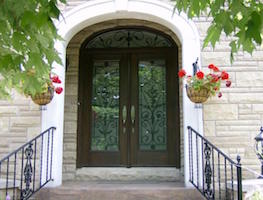 Fiberglass door with Wrought Iron in panel and transom