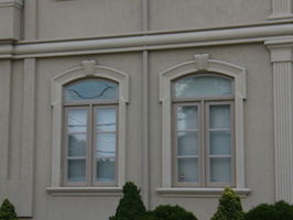 window with shaped transom with sidelites grills